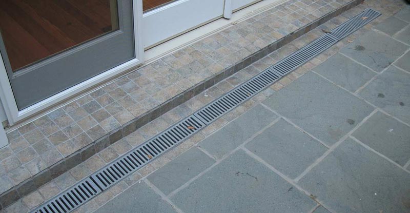 Patio drainage solutions raised